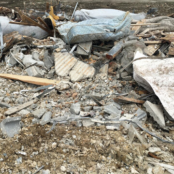 Mattresses And Other Garbage From An Old Hotel Being Demolished