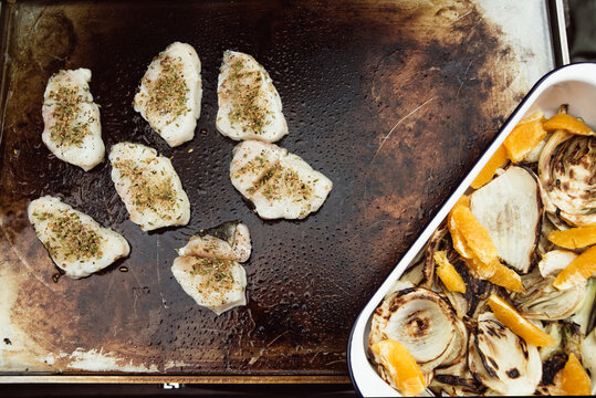 Food: Grilling herbed cod filets on a plancha