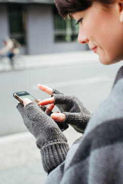 Close Up of Cute Caucasian Woman Operating Smarphone With Finger Gesture