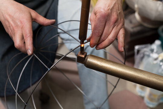 Artisan at Work in his Workshop making lampshades.