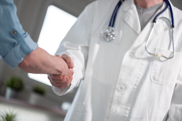 Handshake between doctor and patient
