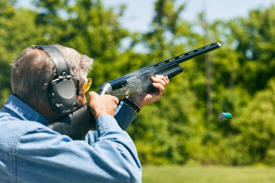 Shooting: Smoke And Cartridge Expelled From Shotgun While Shooting