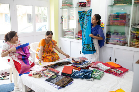 A Businesswoman deals with her client in a small shop