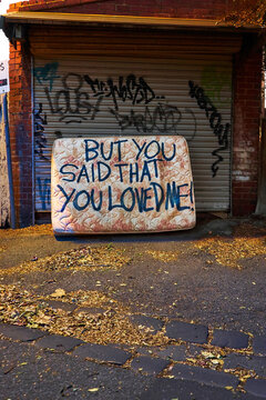Abandoned matres with message sprayed