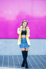 Young woman wearing a yellow jacket and headband