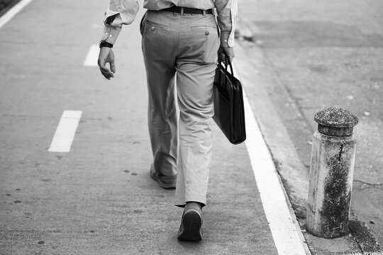Businessman walking with a portfolio