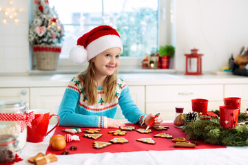 Kids bake Christmas cookies. Child cook for Xmas.