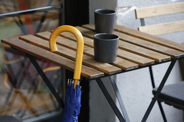 front view blue umbrella on wall