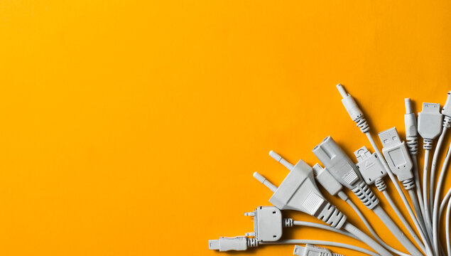 Various cable jacks and plugs on orange background