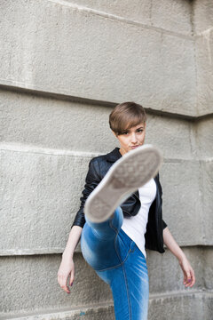 young woman kicking .