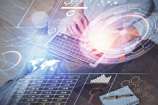 Multi exposure of data internet theme hologram with man working on computer on background. Concept of innovation.