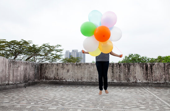 Young girl doing exercise at roof top