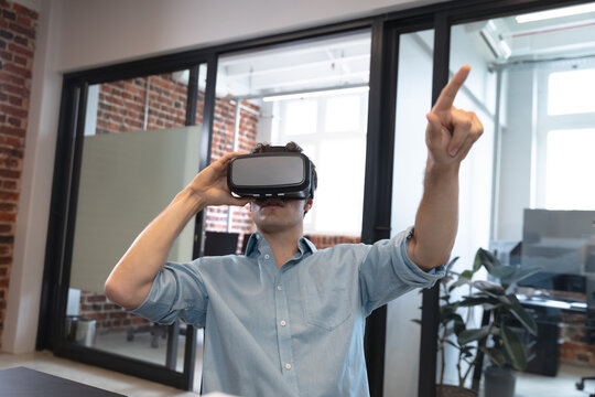 Man using VR headset at office