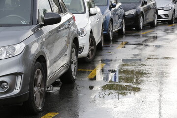 Cars parked on a rainy day