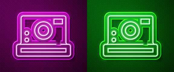 Glowing neon line Photo camera icon isolated on purple and green background. Foto camera icon. Vector.