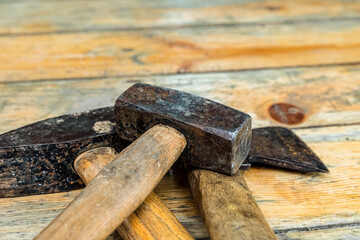 builder work tool heavy black hammer and ax close-up