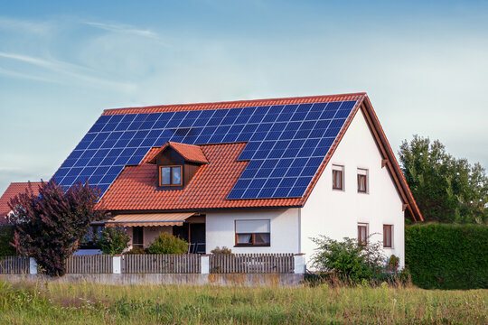 Alternative Energy for a Innovative House. Building and surrounding modified by image editing.