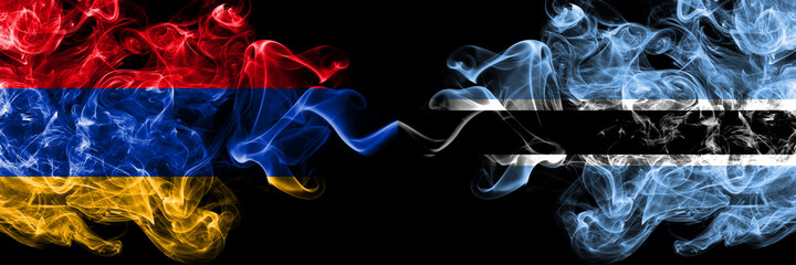 Armenia vs Botswana, Botswanan smoky mystic flags placed side by side. Thick colored silky abstract smoke flags