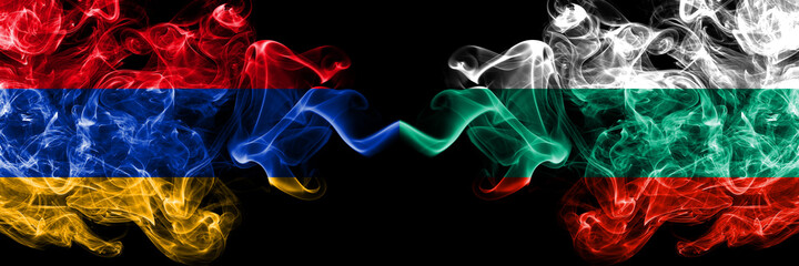 Armenia vs Bulgaria, Bulgarian smoky mystic flags placed side by side. Thick colored silky abstract smoke flags