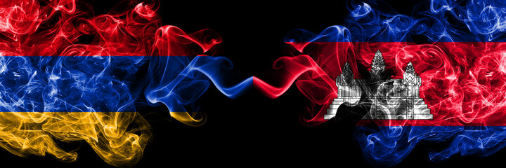 Armenia vs Cambodia, Cambodian smoky mystic flags placed side by side. Thick colored silky abstract smoke flags