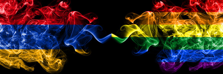 Armenia vs Gay pride smoky mystic flags placed side by side. Thick colored silky abstract smoke flags