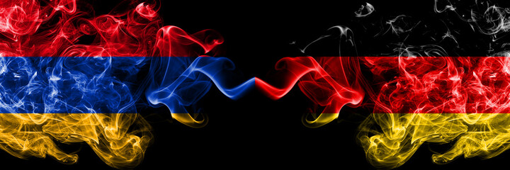 Armenia vs Germany, German smoky mystic flags placed side by side. Thick colored silky abstract smoke flags