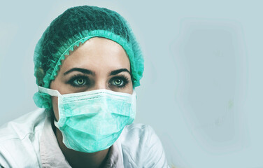 Fototapeta na wymiar Woman doctor wearing a medical protective mask against coronavir