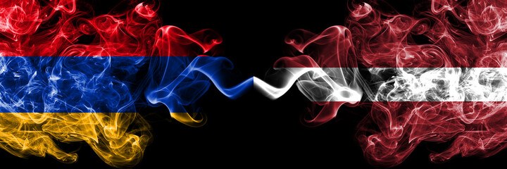 Armenia vs Latvia, Latvian smoky mystic flags placed side by side. Thick colored silky abstract smoke flags