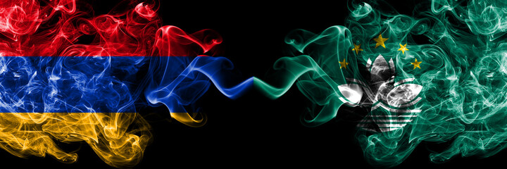 Armenia vs Macau, China smoky mystic flags placed side by side. Thick colored silky abstract smoke flags