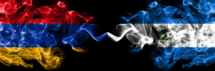 Armenia vs Nicaragua, Nicaraguan smoky mystic flags placed side by side. Thick colored silky abstract smoke flags