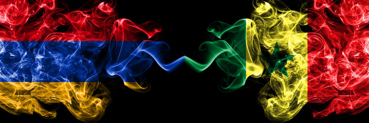 Armenia vs Senegal, Senegalese smoky mystic flags placed side by side. Thick colored silky abstract smoke flags
