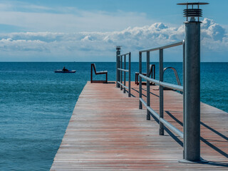 Naklejka premium Baltic Sea Pier with benches reflect the opposite way of life
