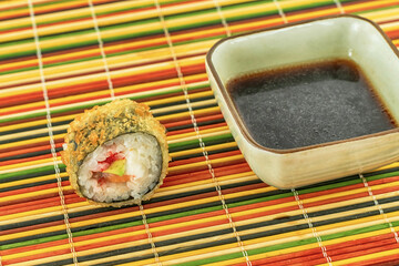 sushi roll with salmon, baked tempura with soy sauce