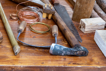 set of instruments for the production of musical string instruments lies on a table