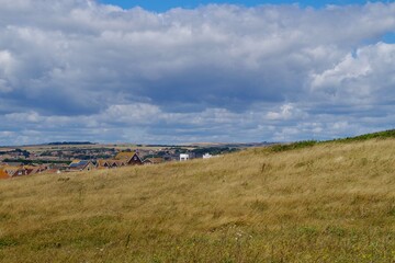 Views of the countryside, summer and a white cloudy skies over Peacehaven and Southdowns National Park, England