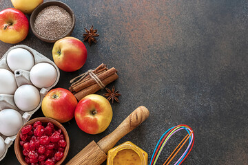 Autumn pastries. Preparation of seasonal fall baked goods with ingredients. Traditional autumn apple pie, spices, apples, accessories.