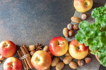 Autumn pastries. Preparation of seasonal fall baked goods with ingredients. Traditional autumn apple pie, spices, apples, accessories.