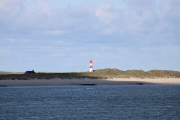 Fototapeta premium Lighthouse on Ellenbogen in the North of Sylt in Wadden Sea National Park