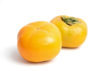 Fresh ripe persimmon isolated on white background
