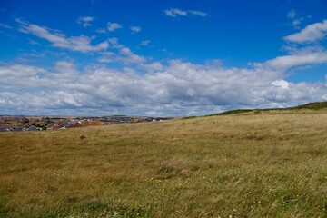 Views of the countryside, summer and a white cloudy skies over Peacehaven and Southdowns National Park, England