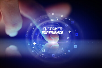 Finger touching tablet with social media icons and CUSTOMER EXPERIENCE