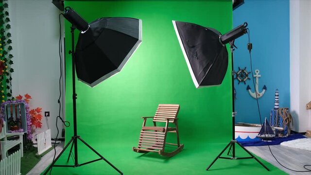 Photo studio with chairs and modern equipment