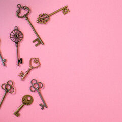 Many different old keys from different locks, scattered chaotically, flat lay.