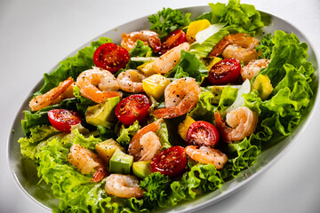 Prawn salad on gray background