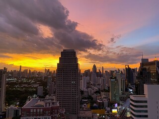 Dramatic clouds at sunset from high angle view rooftop in Asoke, Bangkok