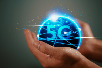 The abstract image of business man hold the 5G hologram and internet of things on hand
