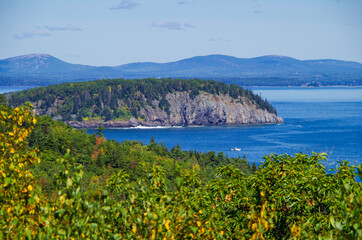 Ocean surf and wash on rocky coast line of Acadia National Park, a popular cruise tour nature...
