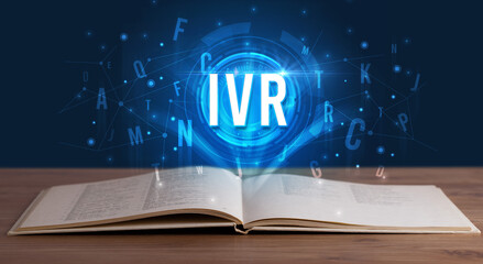 IVR inscription coming out from an open book, digital technology concept