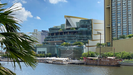 View across river to Icon Siam mall with palm tree