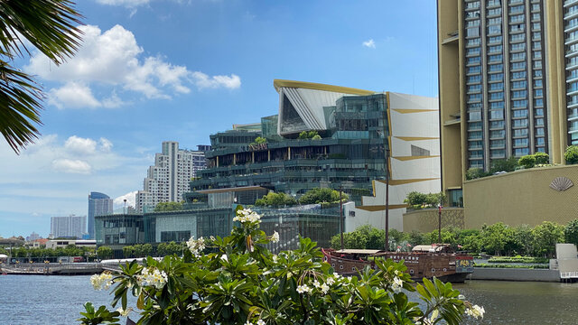 View across river to Icon Siam mall with palm tree